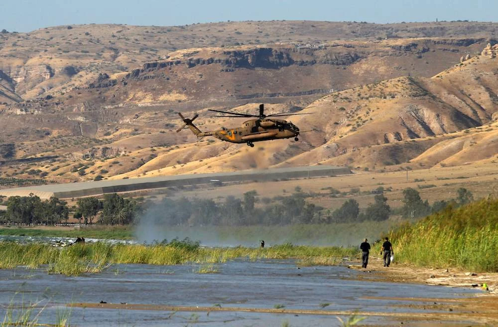 A Sikorsky CH-53K King Stallion helps searching the Sea of Galilee coasts for remains of a reported drone launched from Syria and intercepted by a Patriot missile on July 11, 2018, near the Ha-On kibbutz, northeastern Israel. (AFP)
