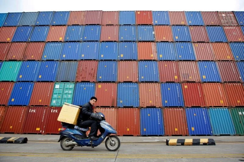 Chinese exporters have being rushing through shipments before US tariffs come into effect. Above, containers at the Port of Shanghai. (Reuters)