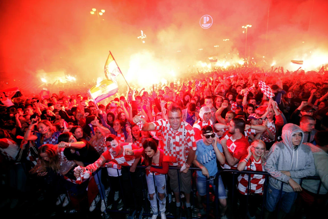 Croatian fans cheer while watching the World Cup semifinal match between Croatia and England, in Zagreb. In the Balkans, even soccer is political, so it is no surprise that Croatia’s stunning success has resulted in mixed reactions and strong emotions in the region. (AP Photo)