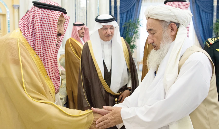 King Salman receives Afghan scholars attending the two-day peace conclave in Jeddah on Wednesday. (SPA)