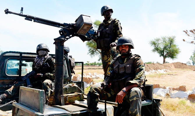 In this file photo taken on November 12, 2014 shows Cameroonian soldiers patroling in Amchide, northern Cameroon. (AFP)