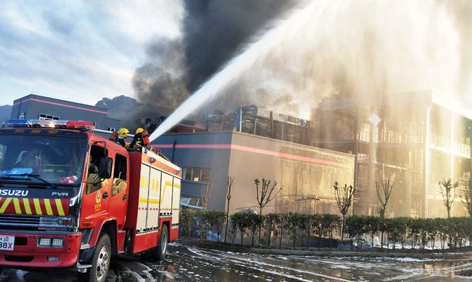 This photo taken on July 12, 2018 shows firefighters working to put out a fire after an explosion at a chemical plant in Yibin in China's southwestern Sichuan province. (AFP)