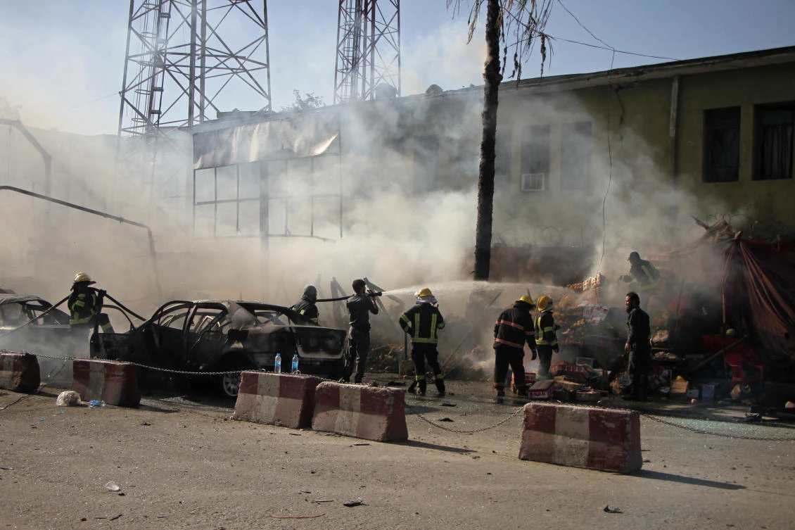 Police and firemen work at the site of a deadly suicide attack in Jalalabad, Afghanistan. (File Photo: AP)