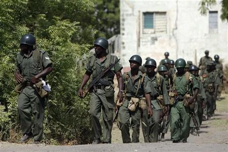 Nigerian soldiers patrol Panshekara district on the outskirts of the northern city of Kano April 19, 2007. (Reuters)