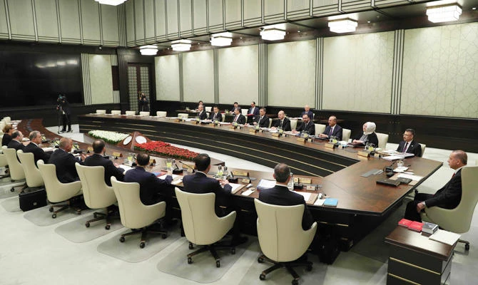 This handout photograph taken and released by The Turkish Presidential Press Office on July 13, 2018, shows Turkish President Recep Tayyip Erdogan (R) as he chairs the first meeting of the presidential Cabinet at The Presidential Complex in Ankara. (AFP)