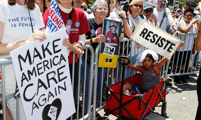 People rally at the Families Belong Together - Freedom for Immigrants March in downtown Los Angeles on Saturday, June 30, 2018. (AP)