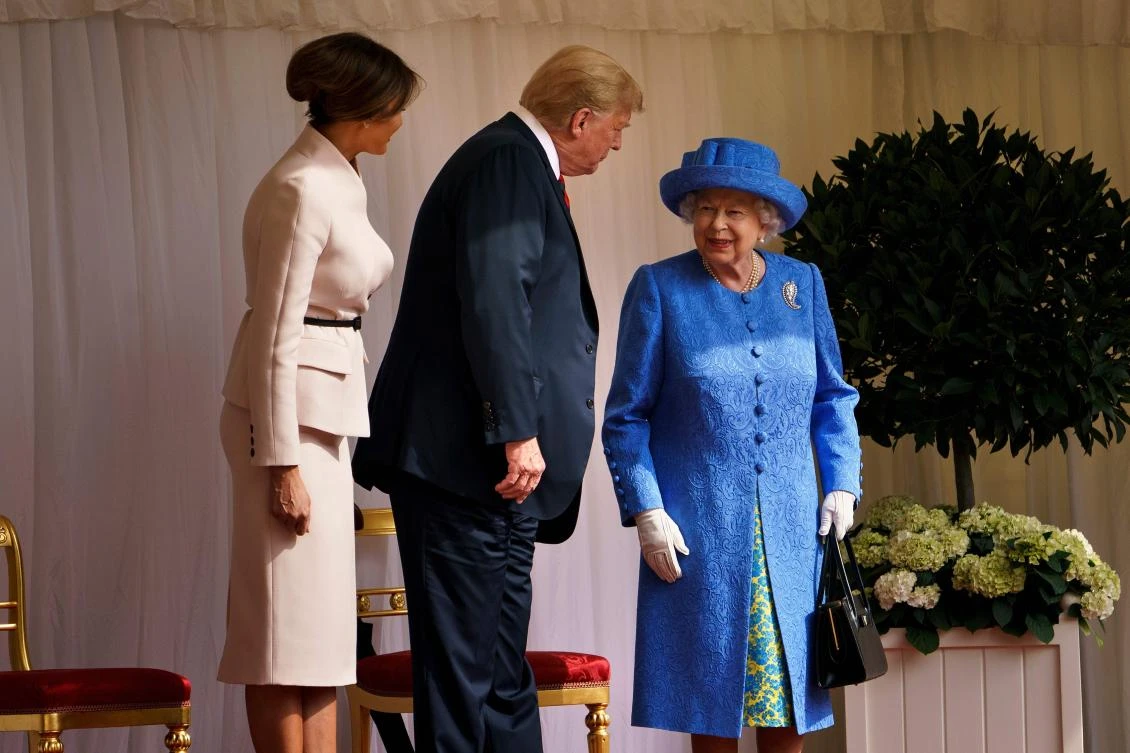 US President Donald Trump speaks with Britain's Queen Elizabeth II as US First Lady Melania Trump looks on at Windsor Castle in Windsor, west of London, on July 13, 2018 on the second day of Trump's UK visit. (AFP/Brendan Smialowski)