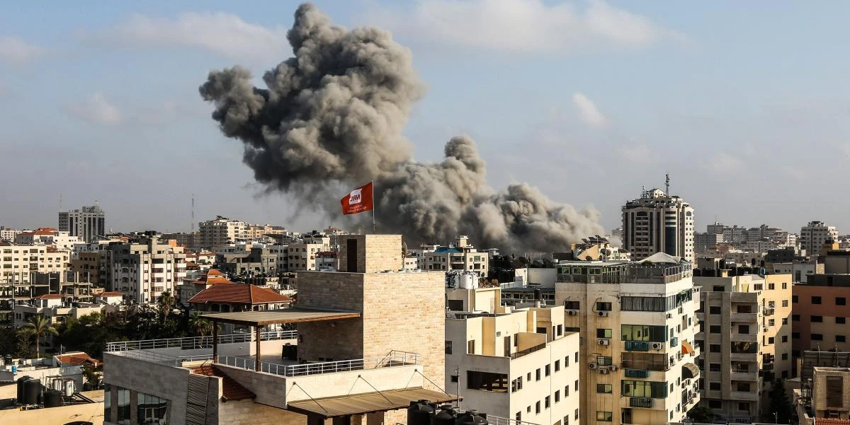 A picture taken on July 14, 2018 shows smoke plumes rising following an Israeli air strike in Gaza City. (Mahmud Hams/AFP)