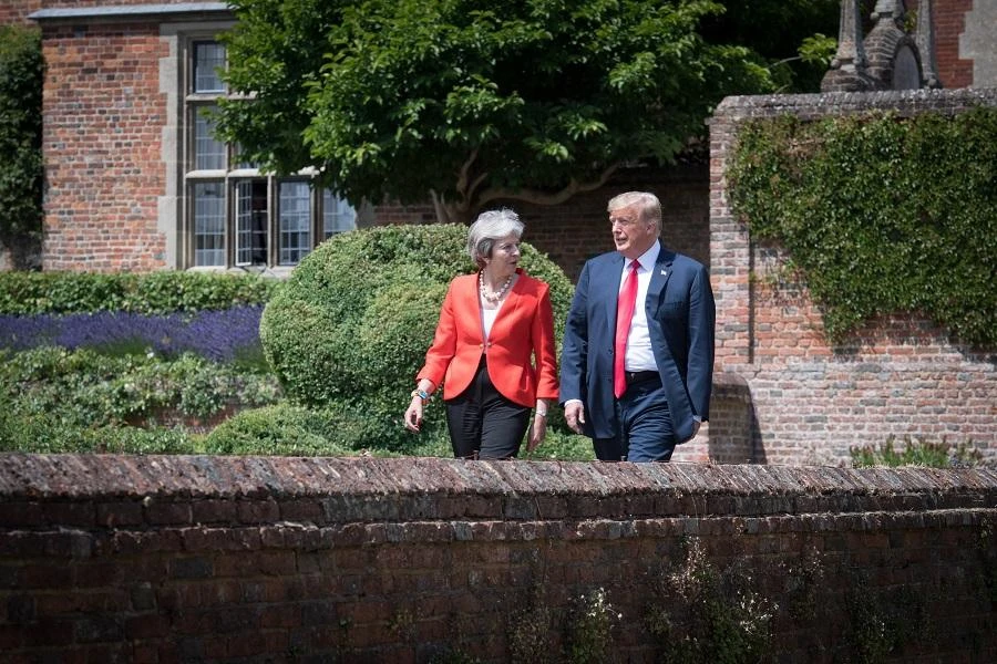 US President Donald Trump (R) and Britain's Prime Minister Theresa May (L) walk together before their joint press conference. (AFP)