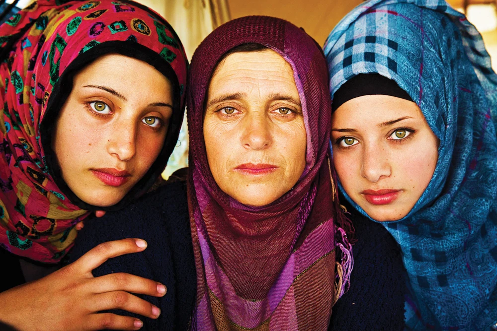 Idomeni refugee camp, Greece: “This mother and her two daughters fled the war in Syria.” (Mihaela Noroc photo)
