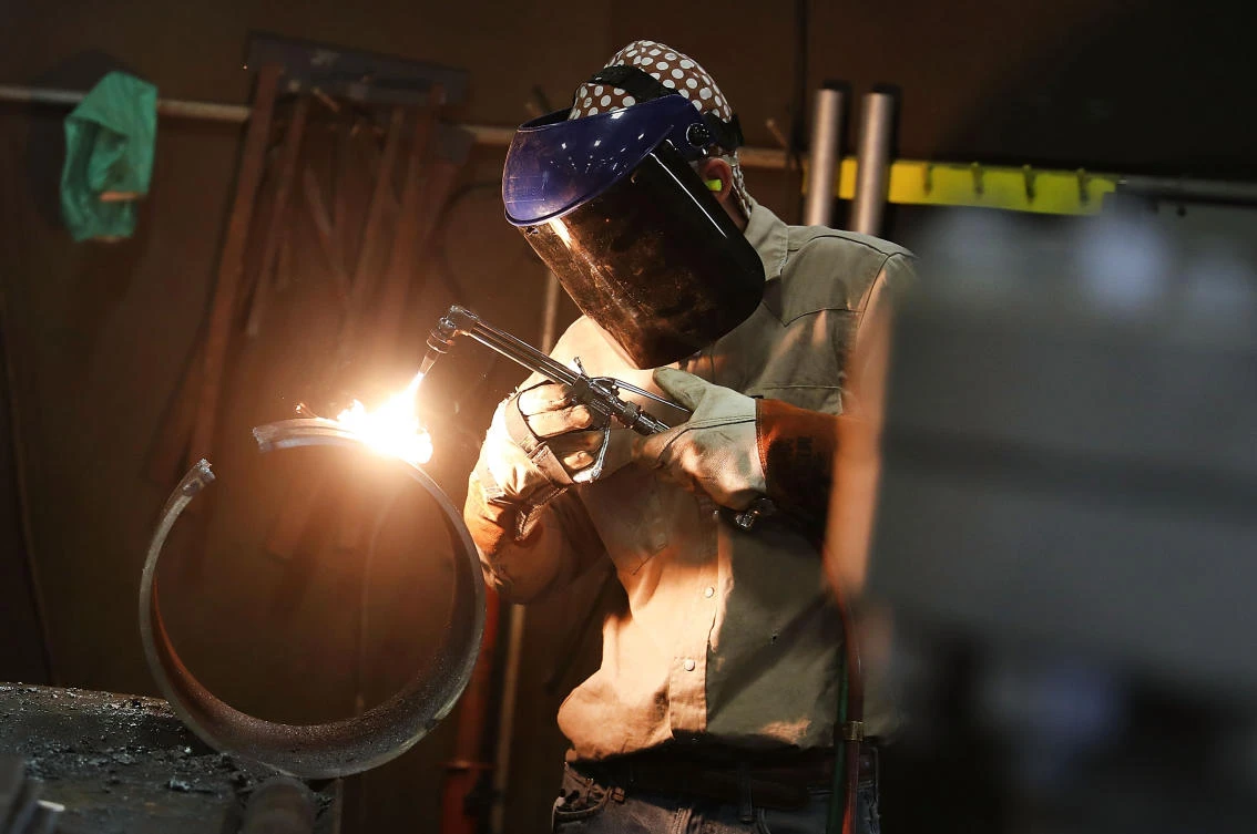 About a quarter of US manufacturer said in the survey that they were delaying planned investments, and 16 percent reported having to raise prices. (AFP)