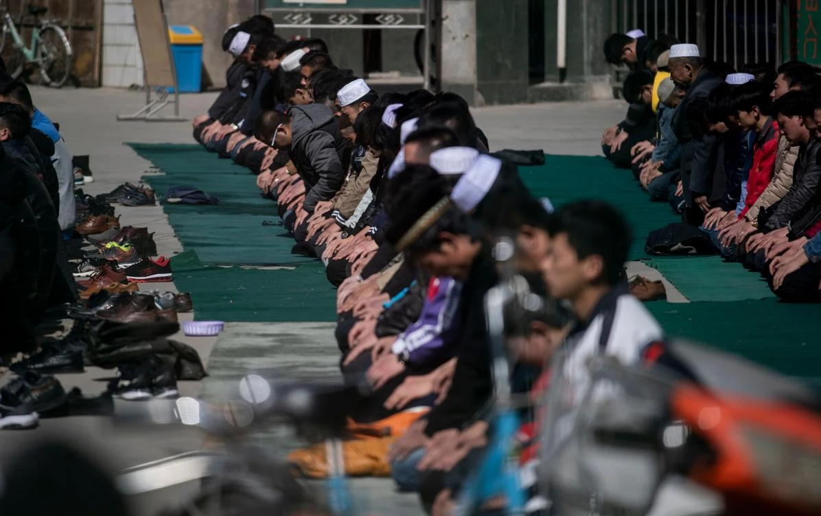 Men pray at the Nanguan Mosque in Linxia, China’s Gansu province. The atheist ruling Communist Party has banned minors under 16 from religious activity or study in Linxia. (AFP)
