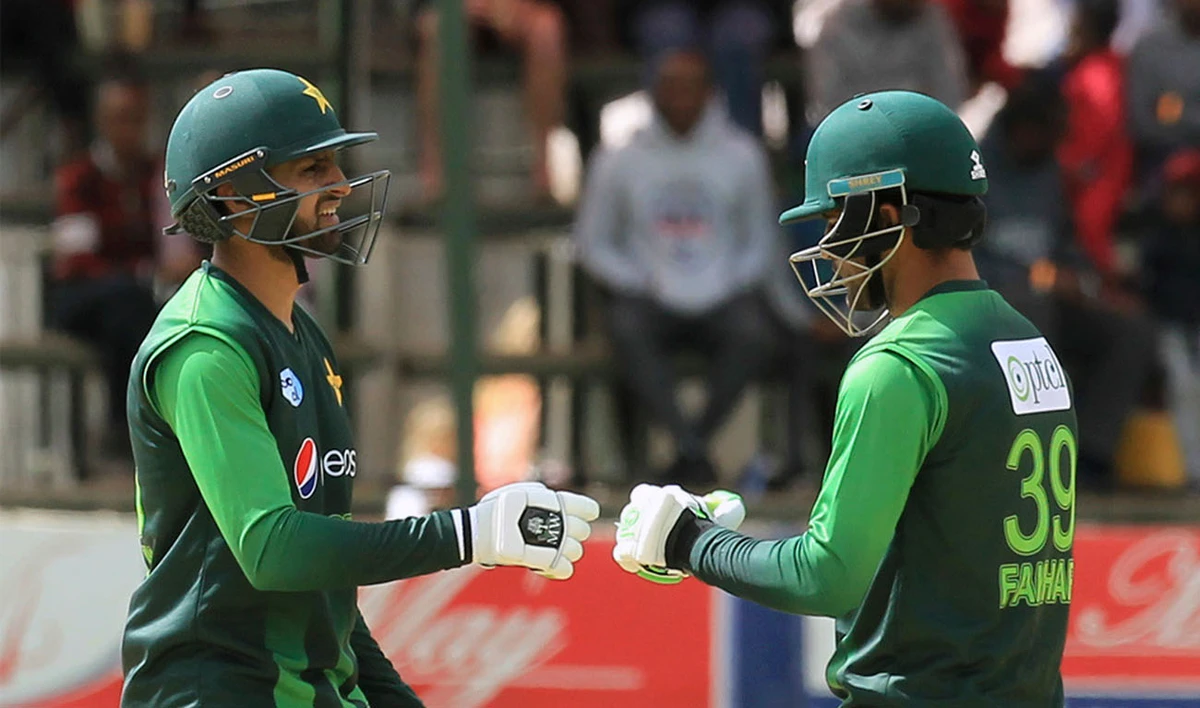 In this file photo, Pakistan’s Fakhar Zaman, left, gestures with Shoaib Malik on the final day of the T20 cricket match between Australia and Pakistan at the Harare Sports Club, in Harare, Sunday, July 8, 2018. (TSVANGIRAYI MUKWAZHI/AP)