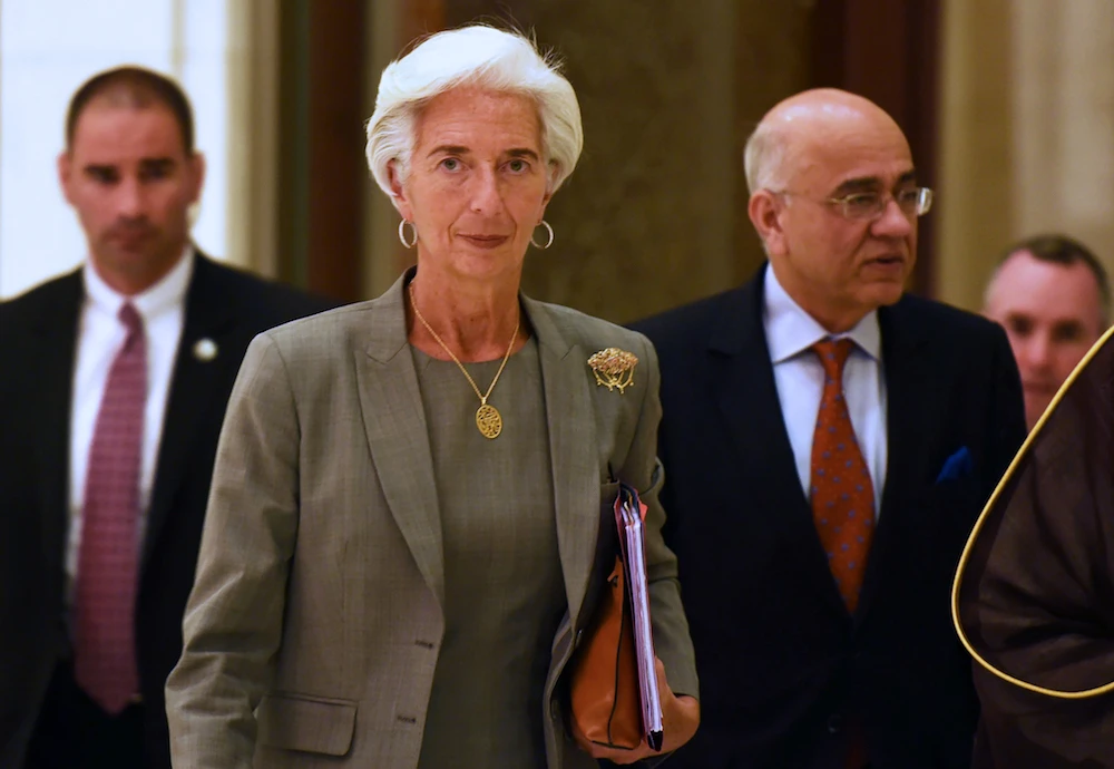 IMF Managing Director Christine Lagarde (C) arrives to attend a meeting with Gulf Cooperation Council (GCC) finance ministers in the Saudi capital, Riyadh. (File photo AFP)