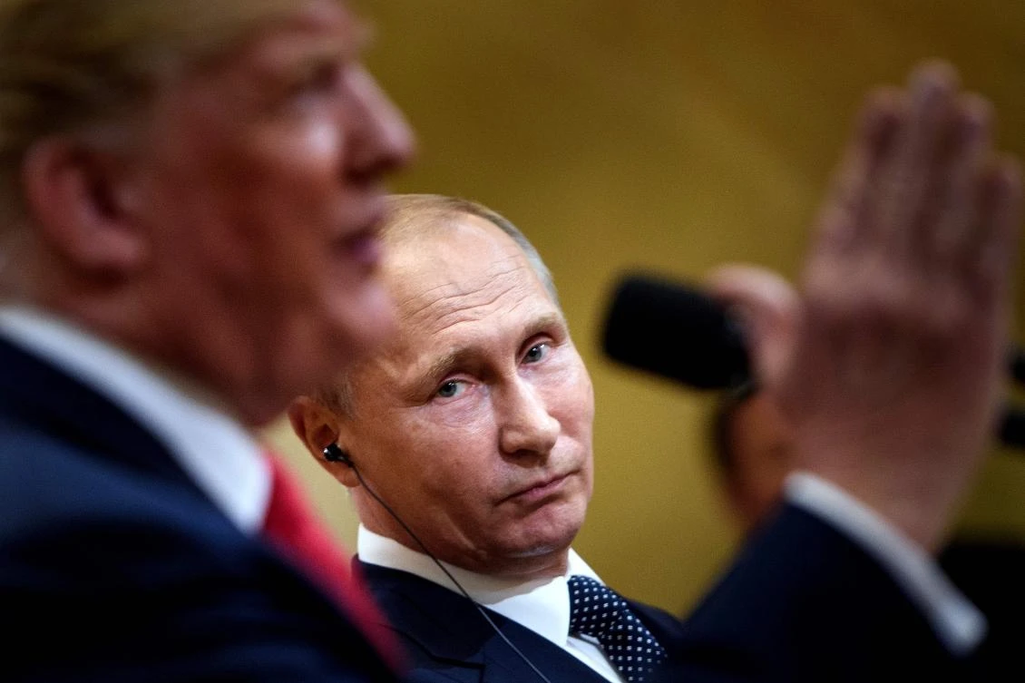 Russia’s President Vladimir Putin listens while US President Donald Trump speaks during a press conference at Finland’s Presidential Palace on Monday, July 16. (AFP)