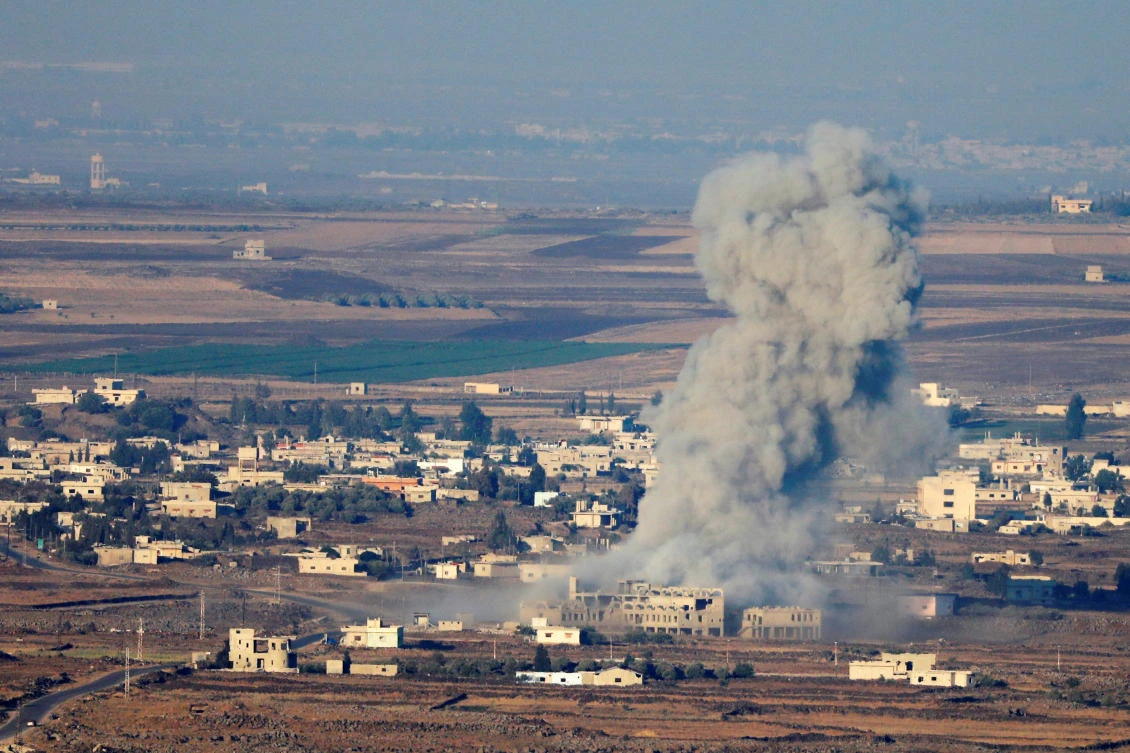Smoke following an explosion in Syria is seen from the Israeli-occupied Golan Heights near the Israeli Syrian border July 16, 2018. (Ronen Zvulun/Reuters)