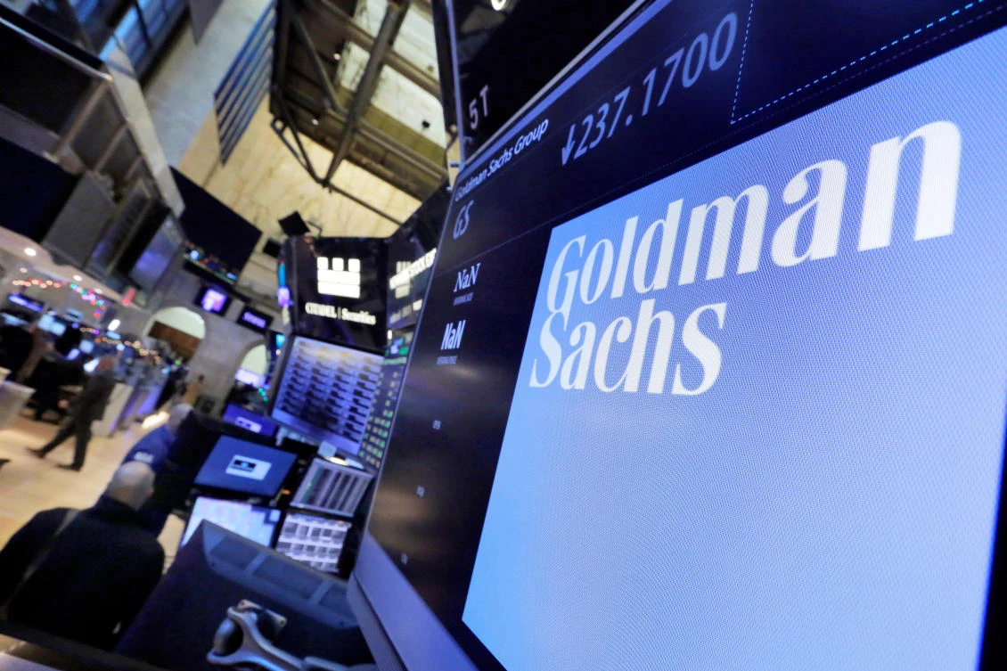In this Dec. 13, 2016, file photo, the logo for Goldman Sachs appears above a trading post on the floor of the New York Stock Exchange. (AP Photo/Richard Drew, File)