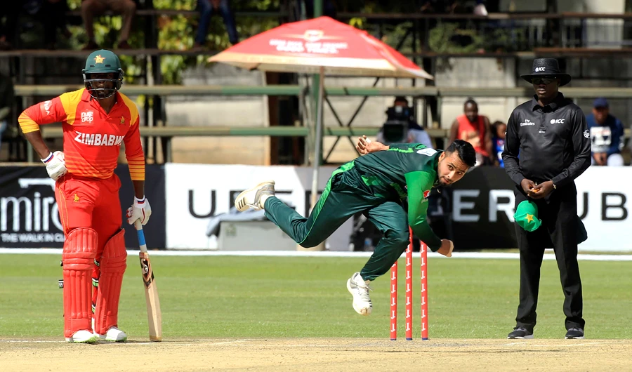In this file photo, Pakistan bowler Faheem Ashraf, center, in action during the T20 cricket match against Zimbabwe at Harare Sports Club, in Harare, Zimbabwe, on July, 4, 2018. (AP)