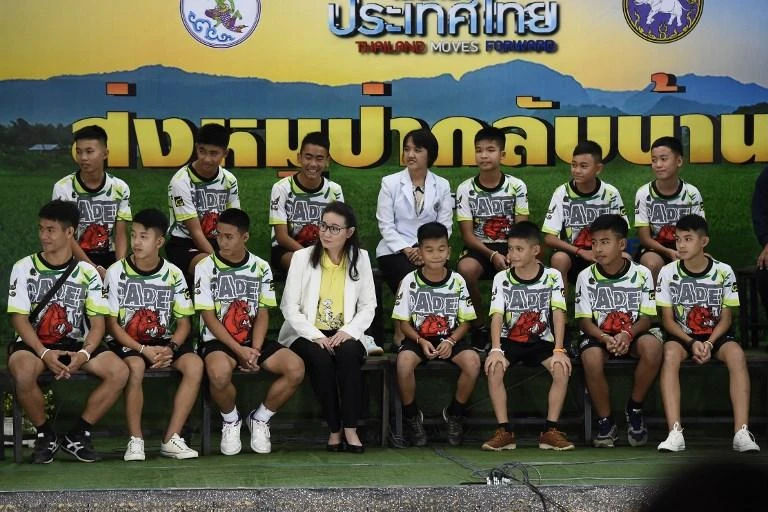 Thai cave boys wave and smile in first public appearance after rescue