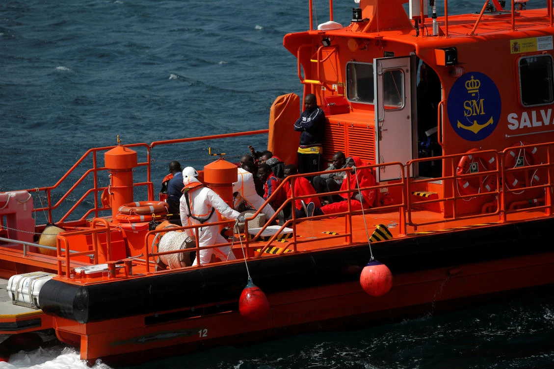 Migrants, intercepted aboard a toy dinghy off the coast in the Strait of Gibraltar, are seen on a rescue boat upon arrival at the port of Tarifa, southern Spain July 17, 2018. (Reuters)