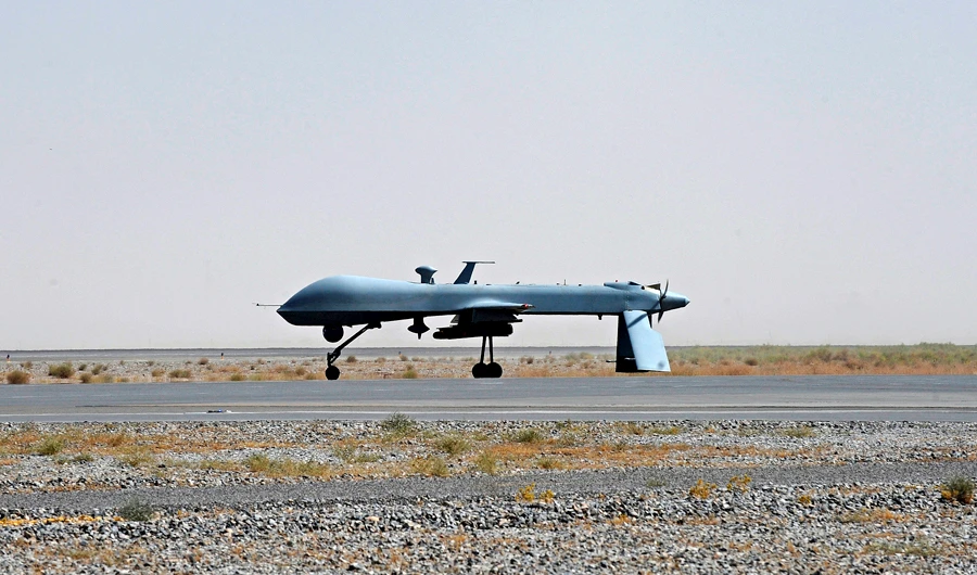 In this file photo, A US Predator unmanned drone armed with a missile stands on the tarmac of Kandahar military airport on June 13, 2010. (REUTERS/Massoud Hossaini)