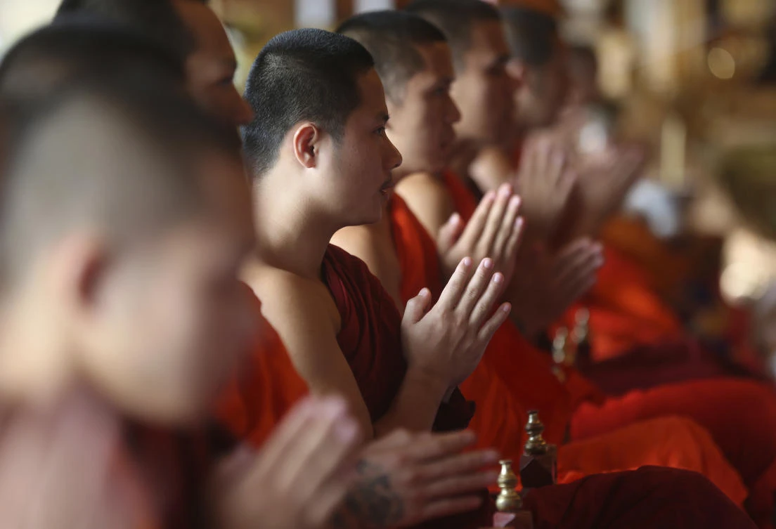 Rescued Thai football boys pray for protection at Buddhist temple