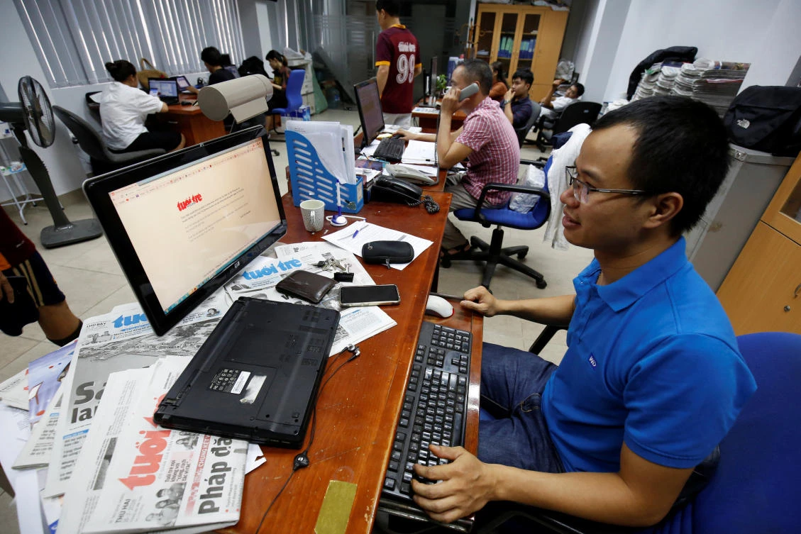 A journalist shows the banned online edition of Tuoi Tre newspaper at the newspaper’s office in Hanoi on Tuesday, July 17. (Reuters)
