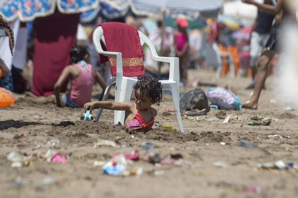A child plays at the beach of Rabat on July 12, 2018 Every summer, the Moroccan press publishes reports revolted on the state of different beaches of the Atlantic and the Mediterranean.(AFP)
