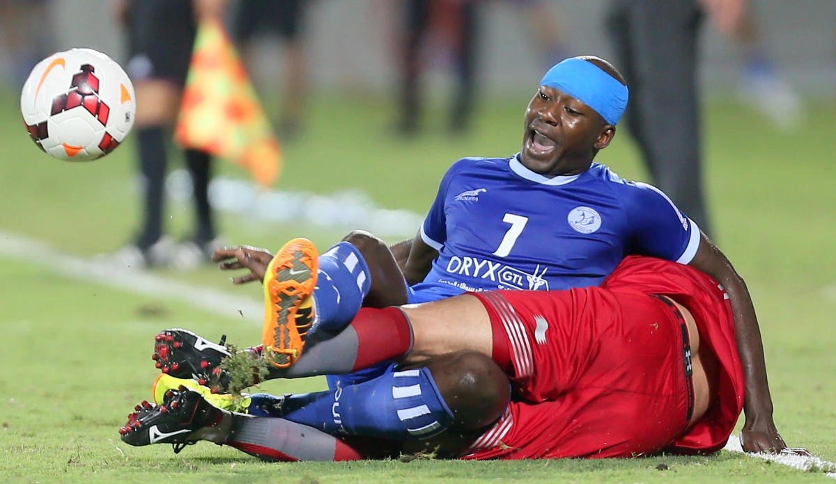 Qatar Al-Kharaitiyat (blue shirt) have been hit with a fine by FIFA. (AFP)