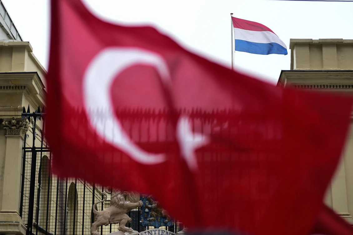 This picture taken on March 12, 2017, shows a Turkish national flag waved in front of the Dutch Consulate in Istanbul. (File photo: AFP)