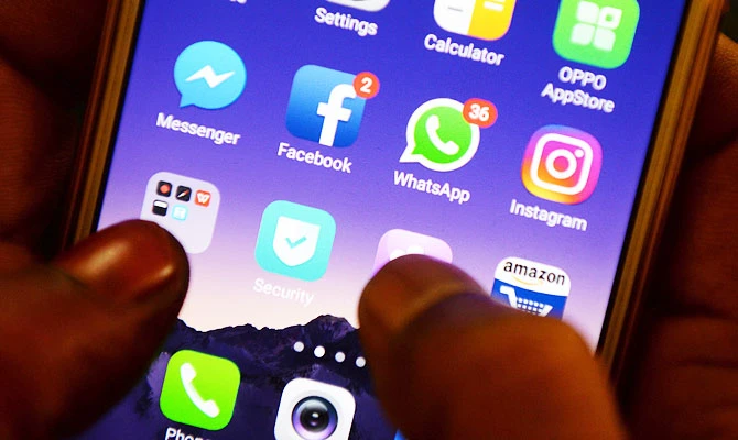 This file photo taken on March 22, 2018 shows apps for WhatsApp, Facebook, Instagram and other social networks on a smartphone. (AFP)
