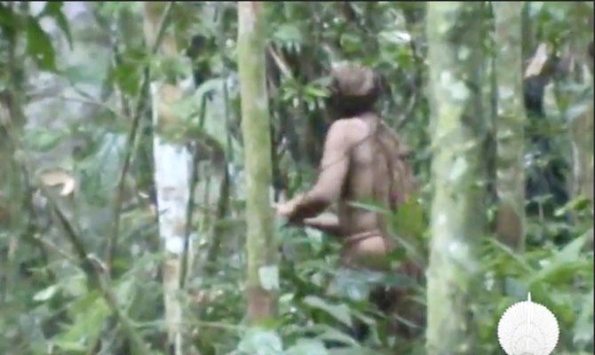 In this 2011 video frame released by Brazil's National Indian Foundation, an uncontacted indigenous man is seen amid the forest, in Rondonia, Brazil. (AP)