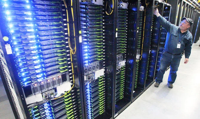 In this Oct. 15, 2013, file photo, Chuck Goolsbee, site director for Facebook's Prineville data centers, shows the computer servers that store users' photos and other data, at the Facebook site in Prineville, Ore. (AP)