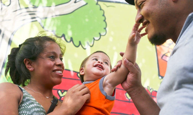 Tears, then giggles: Honduran baby is back in parents’ arms