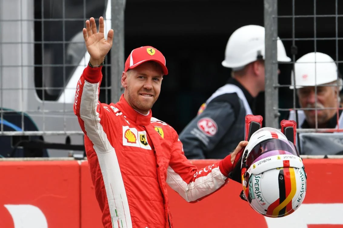Ferrari's German driver Sebastian Vettel celebrates after winning the qualifying session on the eve of the German Formula One Grand Prix. (AFP)