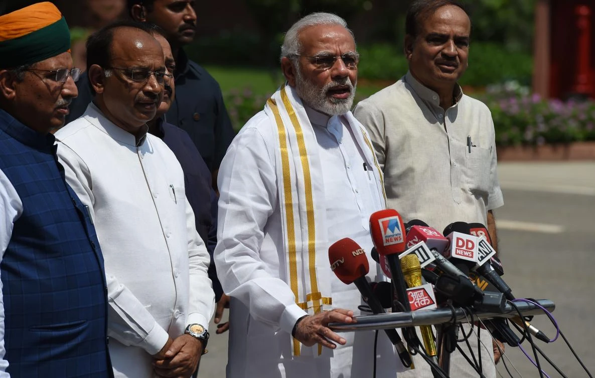 Indian Prime Minister Narendra Modi (C) stands with senior Bharatiya Janata Party (BJP) leaders as he addresses media representatives after arriving for the monsoon session of Parliament in New Delhi on July 18, 2018. (AFP)