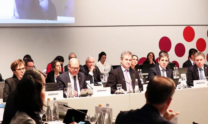 Handout photo released by the G20 Press Office showing the Governor of the Bank of England Mark Carney on a screen as he speaks during a meeting on digital technology as a key to financial inclusion, on the second day of the G20 meeting of Finance Ministers and Central Bank Governors, in Buenos Aires, on July 22, 2018. (AFP)