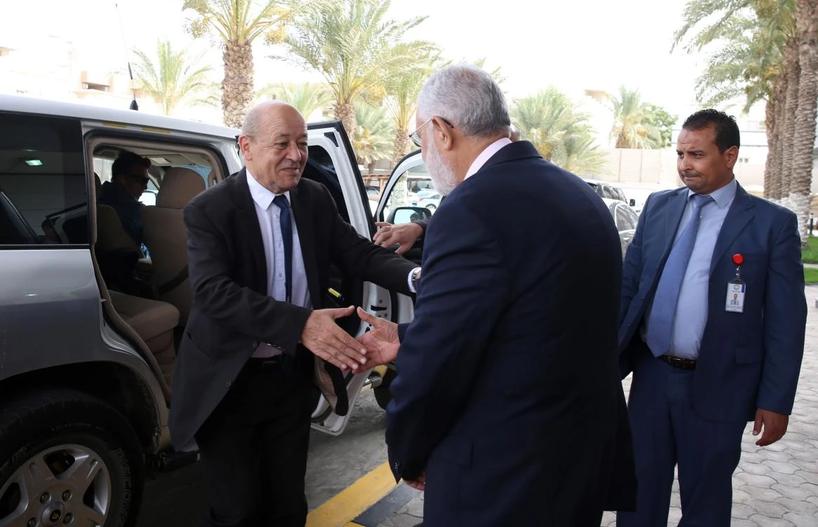 Libyan Minister of Foreign Affairs Mohamed Taha Siala (R), receives French Foreign Affairs Minister Jean-Yves Le Drian (L),in the capital Tripoli on July 23, 2018. (AFP)