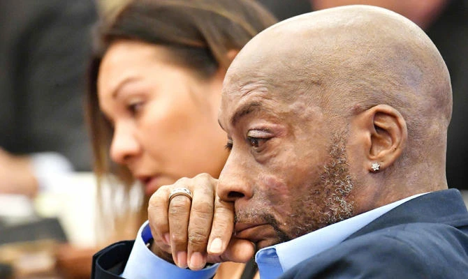 In this file photo taken on July 09, 2018, plaintiff Dewayne Johnson listens as attorney Brent Wisner (out of frame) speaks about his condition during the Monsanto trial in San Francisco, California. (AFP)