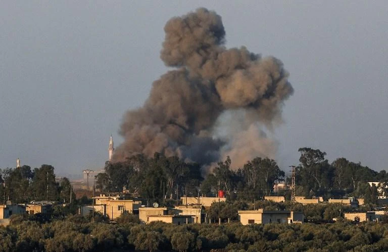 A smoke plume rises during air strikes backing a Syrian-government-led offensive in the southwestern province of Daraa. (AFP)