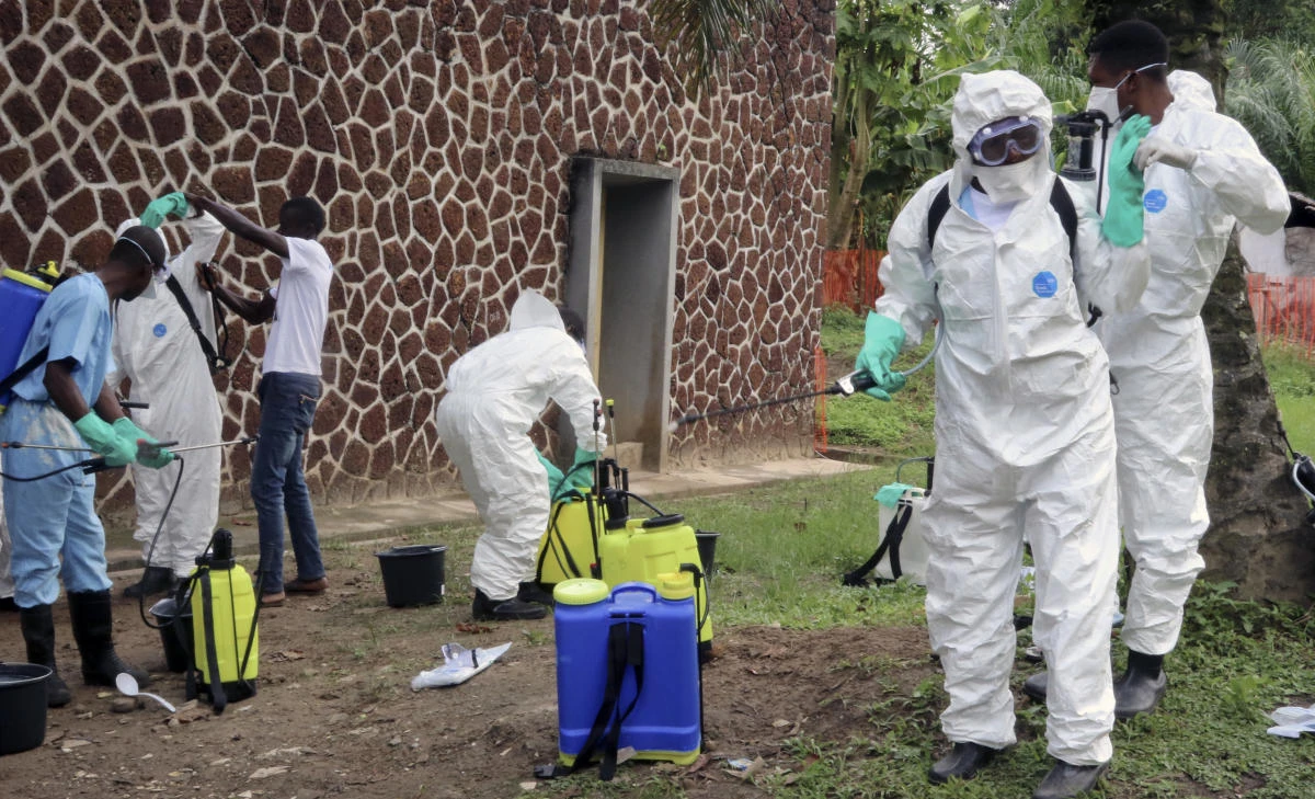 In this file photo taken Thursday, May 31, 2018, Congolese health officials prepare to disinfect people and buildings at the general referral hospital in Mbandaka, Congo. (AP)