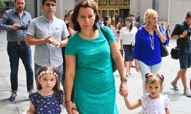 Pablo Villavicencio's wife Sandra Chica, center, and their two daughters, leave federal court after a hearing on his release, Tuesday July 24, 2018, in New York. (AP)