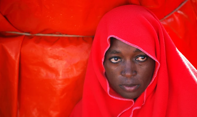 A migrant woman intercepted aboard a toy dinghy off the coast in the Strait of Gibraltar, is seen on a rescue boat after arriving at the port of Tarifa, southern Spain July 23, 2018. (REUTERS)