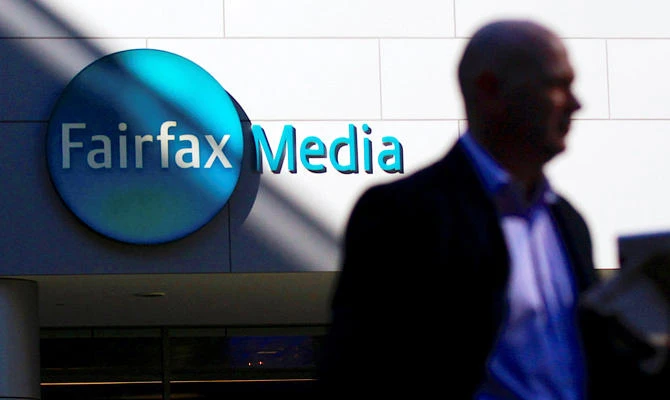 An office worker leaves the Fairfax Media headquarters in Sydney, Australia, in this June 18, 2012 file photo. (REUTERS)