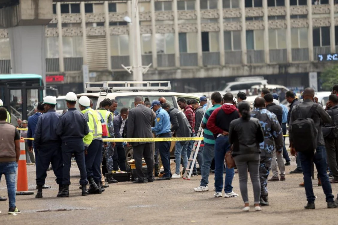 Investigators inspect the scene, where Ethiopia’s Grand Renaissance Dam Project Manager Simegnew Bekele was found dead in his car in Addis Ababa. (Reuters)