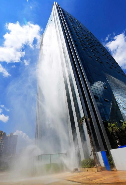 This photo taken on July 20, 2018 shows a 108-meter-high (350 feet) artificial waterfall on the facade of the Liebian International Building in Guiyang in China's southwestern Guizhou province. (AFP)
