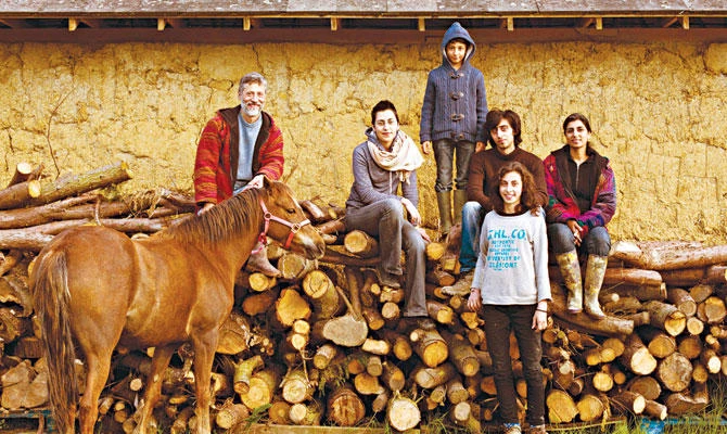 Lutfi and Ruby Radwan with their children, who help run Willowbrook Farm. (Harry Borden)