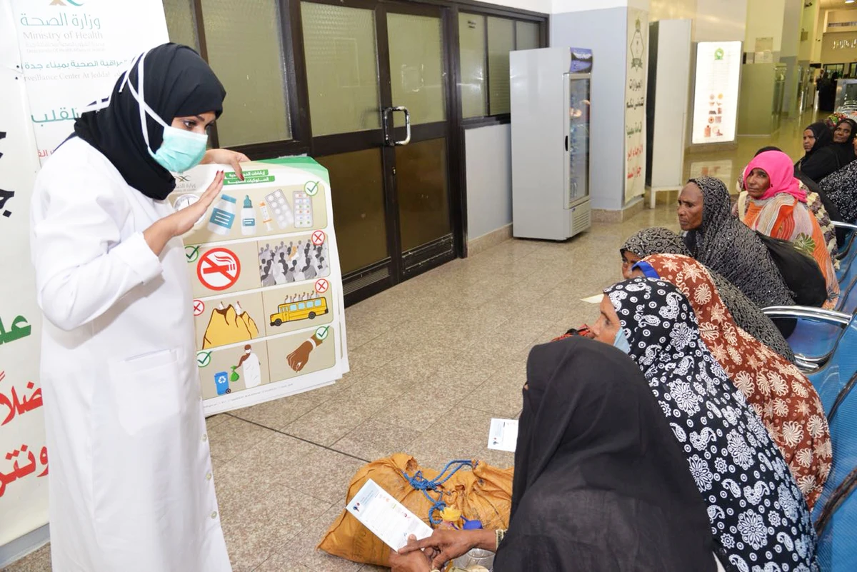 A health worker gives health safety tips to Sudanese women pilgrims on their arrival at the Red Sea Port in Jeddah for the Hajj. (AN photo)