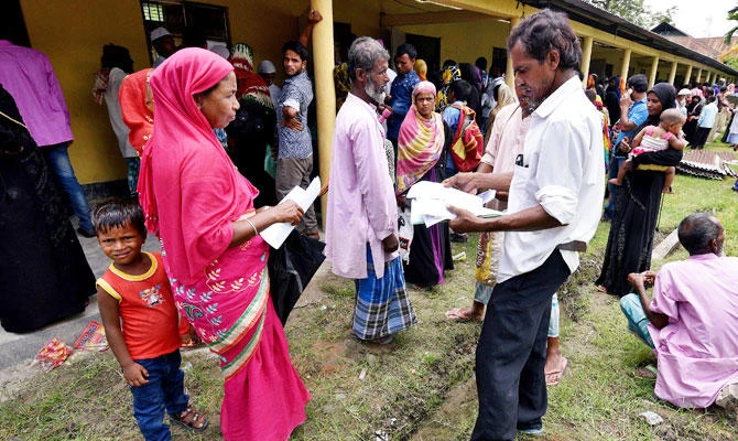 Villagers wait outside the National Register of Citizens (NRC) centre to get their documents verified by government officials, at Mayong Village in Morigaon district, in the northeastern state of Assam, India July 8, 2018. (REUTERS)