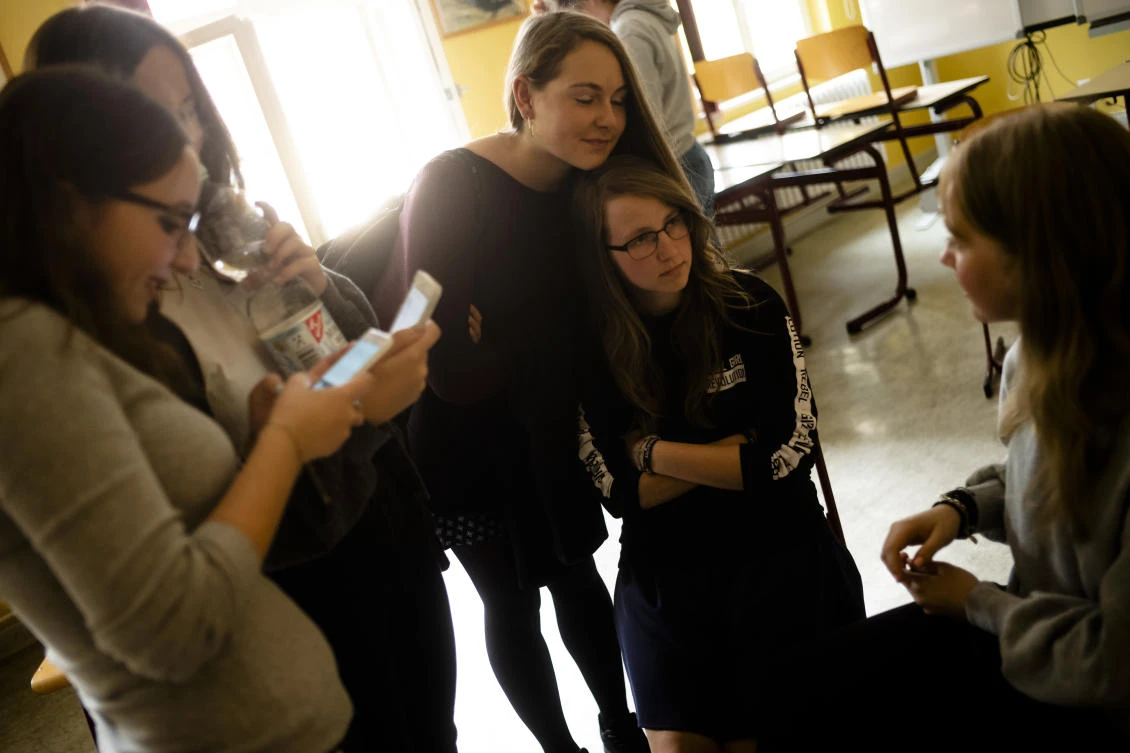 Laura Schulmann, right, and Sophie Steiert, left, answer questions from students about Jewish daily life in Germany after a lesson, as part of a project about religions at the Bohnstedt Gymnasium high school in Luckau, German. (AP/Markus Schreiber)